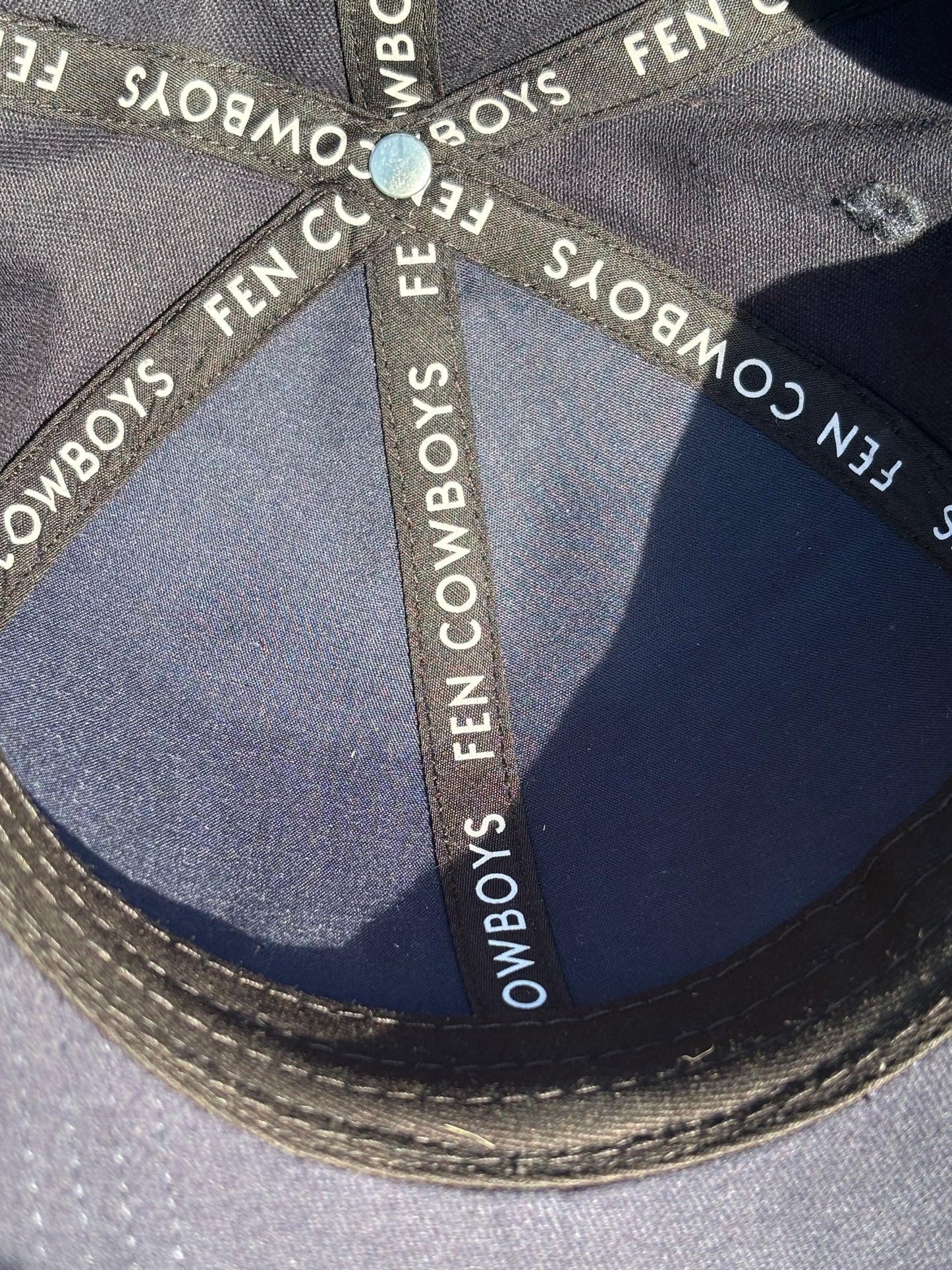 Inside of baseball cap Fen Cowboys